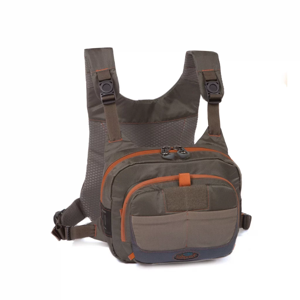 Fishpond Cross-Current Chest Pack Fishpond Cross-Current - Features include Magnetic closure
Front magnetic closure pocket for small fly boxes, pucks, and other quick access items
Integrated net slot on backpanel holds a long handle net
One large pocket on the backpanel with a zippered entry on each side
Magnetic front pocket has velcro interior on one side, and 4 small stretch mesh pockets for organization
Main front zippered pocket includes one interior zippered pocket