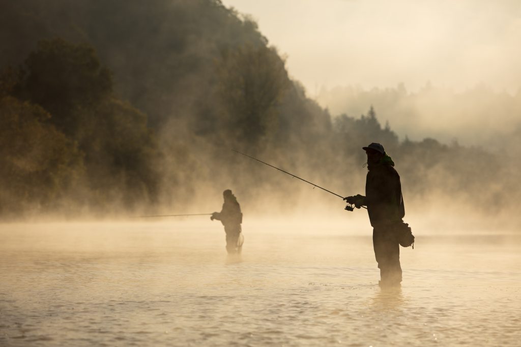 Jumping Rise: Two fly fishermen in morning fog